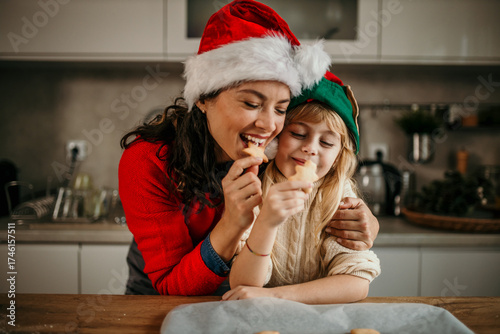 Mother and daughter enjoying christmas baking and cookies