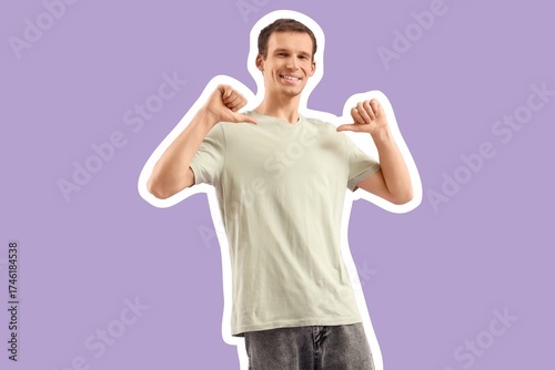 Young man pointing at his t...