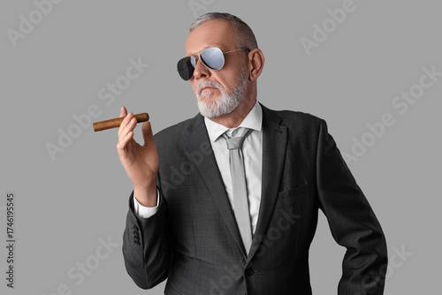 Old businessman in sunglass...