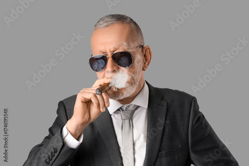 Old businessman in sunglass...