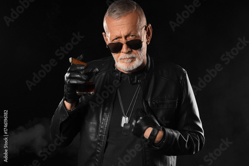 Stylish old man in leather ...