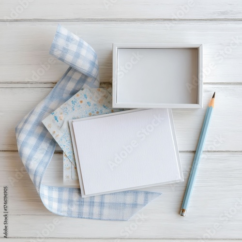 Blank Canvas of Creativity: A scene of artistic tools and decor items artfully arranged on a wood surface, representing inspiration and design possibilities. 
