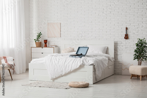 Interior of light bedroom w...