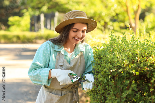 Young female gardener with ...