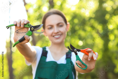 Young female gardener with ...