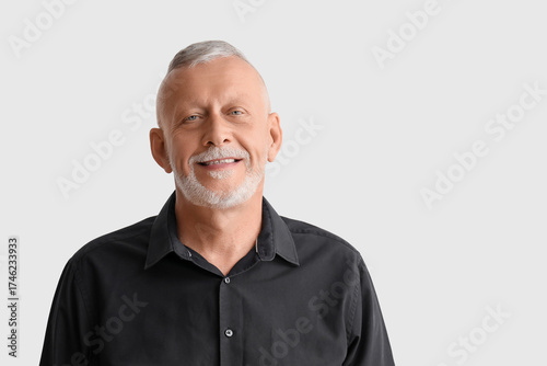 Portrait of senior man on g...