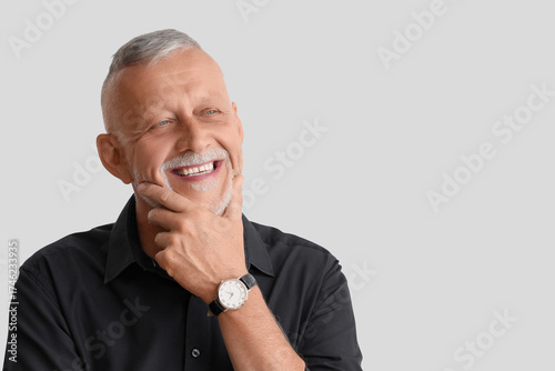 Portrait of senior man on g...