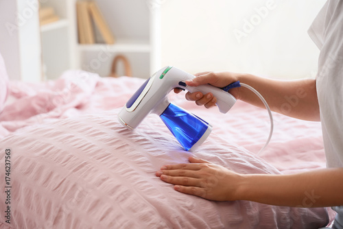Woman using a handheld garm...