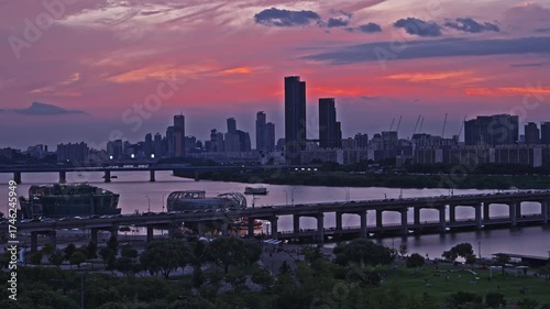 Wallpaper Mural Stunning cityscape of Seoul South Korea with the Banpo Bridge and Han River under a dramatic and colorful red sunset sky at twilight Torontodigital.ca