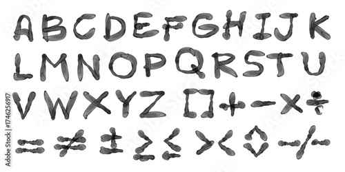 A complete set of uppercase English alphabet letters and a range of mathematical and relational symbols, all rendered in a dark, textured style resembling watercolor or ink-blots.