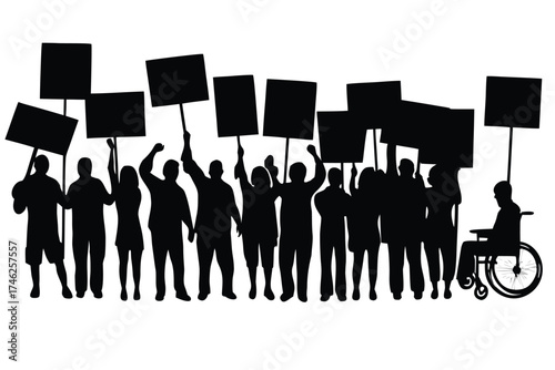 A crowd of people holding protest signs including a person in a wheelchair
