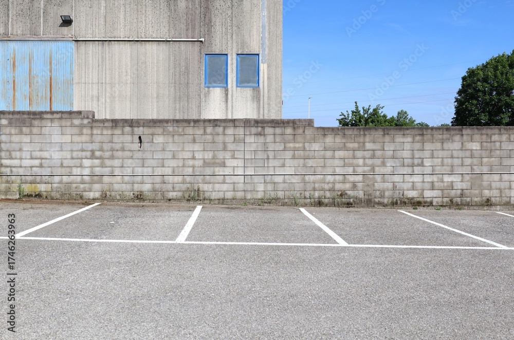 custom made wallpaper toronto digitalCinder block fencel with parking signs in front. Concrete industrial building and sky on behind. Background for copy space.