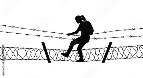 Silhouette of a determined person carefully crossing a barbed wire fence symbolizing overcoming obstacles and challenges