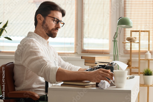Young male writer with vint...