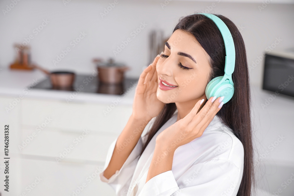 Naklejka premium Mental health and wellness, young woman relaxing with music at home