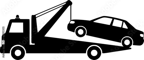 A black tow truck lifting a black car