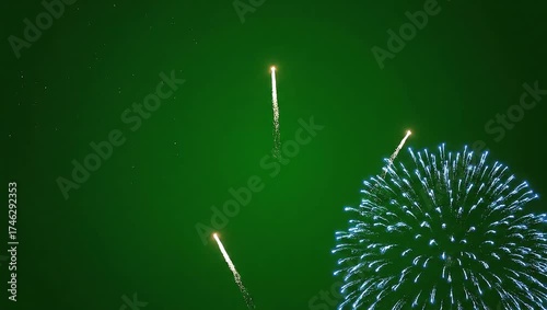 A dynamic visual effects design of blue fireworks bursting and streaking, isolated on a solid green screen for easy video compositing and editing