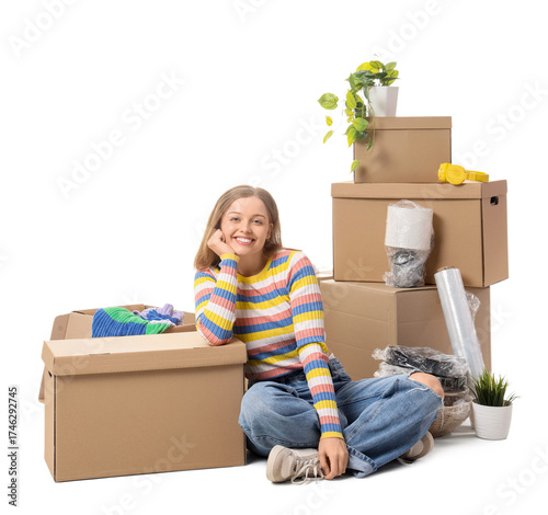 Young woman with moving box...