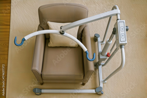 Patient lift next to armchair in home interior.