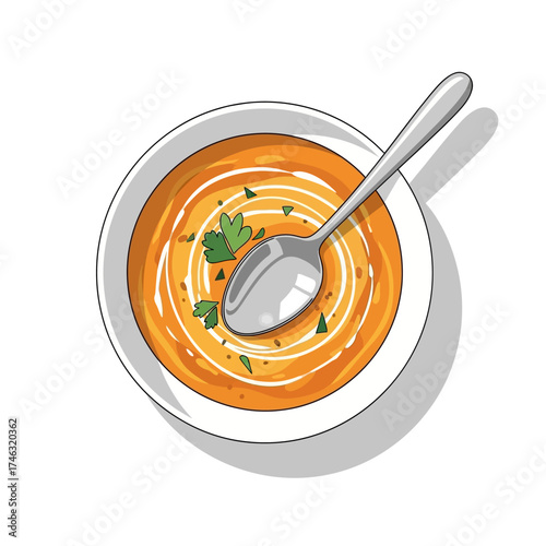 Top view of a bowl of creamy tomato soup with a spoon.