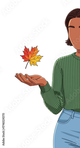 Woman holding a colorful autumn leaf.