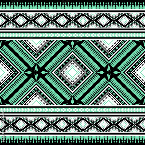 Geometric ethnic tribal seamless pattern featuring diamonds stars and ornate borders in black white and mint green background