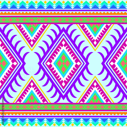 Vibrant geometric ethnic pattern with repeating diamond shapes and zigzag borders set against a light blue background tribal