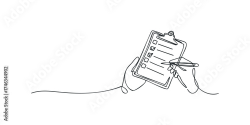 Hand holding clipboard and pen, marking checklist