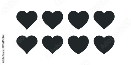 Eight Black Hearts Grouped on White Surface