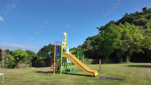 Wallpaper Mural Playground Slide and Green Park Under Clear Blue Sky Torontodigital.ca
