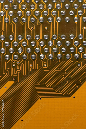 orange old circuit board with contacts and solders with an electronic closeup, an electronic board with electrical components for connecting various electronic devices into one system