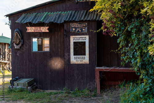 Rustic Wild West Jail with Wanted Poster