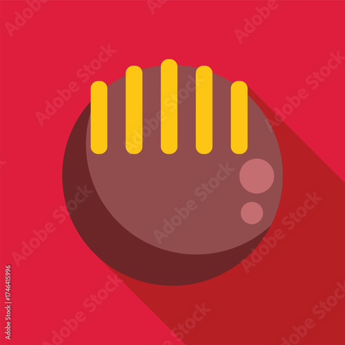 Delicious round chocolate praline with yellow decoration on red background, creating a sweet and tempting image