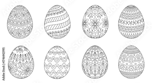 A collection of eight ornately decorated Easter eggs in black and white.