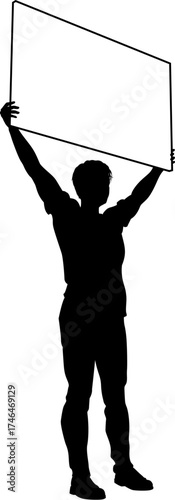 Protestor or demonstrator at a demonstration march, picket line or strike protest rally in silhouette. Holding up a banner or picket sign board placard.