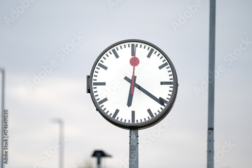 Classic analog clock at the railway station of Tienen, Belgium