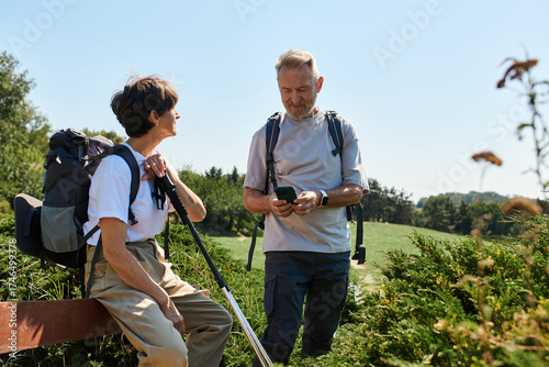 Wallpaper Mural Active seniors exploring nature together during a sunny hike in the mountains Torontodigital.ca