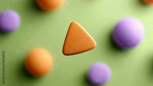 Abstract 3D geometric shapes on a green background.