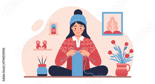 A woman sits indoors, engrossed in the art of knitting with needles and yarn, creating a cozy and creative pastime during winter.