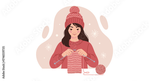 A young woman knits a cozy scarf while wearing a warm winter hat and sweater, enjoying a relaxing hobby in a cozy setting.