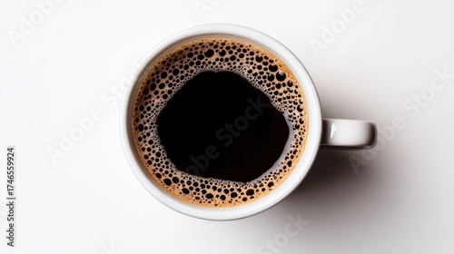 Top-down view of a full cup of dark coffee