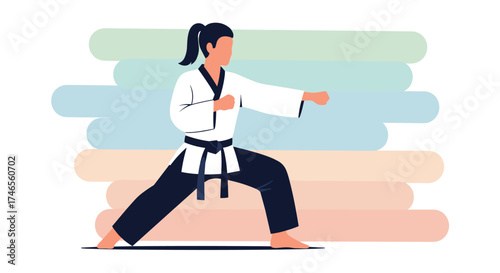 A female karateka in a white gi executes a punch during a training session, demonstrating martial arts and discipline with a dynamic pose.