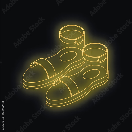 Neon yellow platform sandals with ankle strap glowing on a black background, representing summer fashion and footwear trends