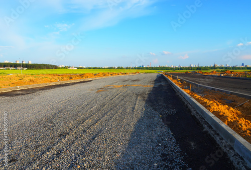 Road during laying asphalt. Highway Road renovation. Road Paved highway. Road before rebuilding, repair, renovation. Street Asphalting. Gravel for a new road construction.