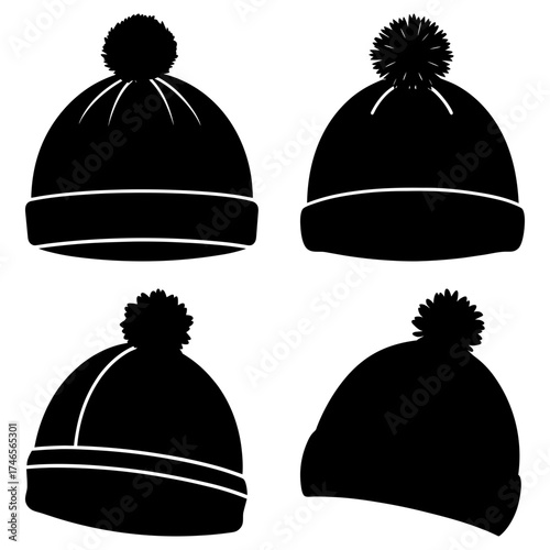 Collection of four black winter hats with pom poms in various styles and orientations on a white backdrop