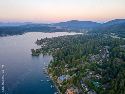 Aerial landscape of Lake Washington forest and mountains at sunset Bellevue suburb of Seattle WA