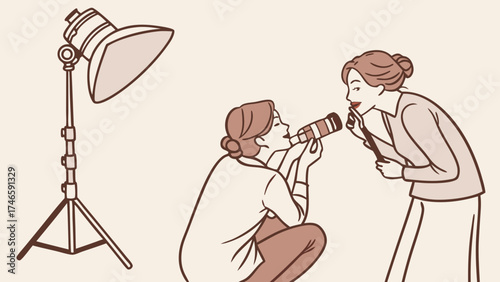 Two women working together on a photoshoot in a studio one taking photos and the other assisting.