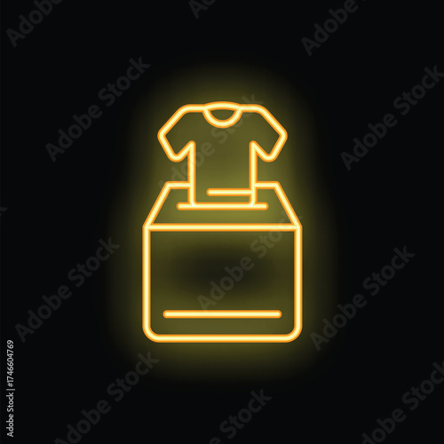 Yellow glowing neon icon of a t shirt being donated in a charity box, representing the concept of clothing donation