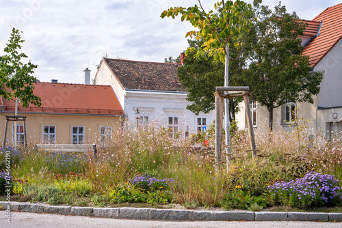Urban green space in autumn in the center of the city of Baden near Vienna (Austria) to reduce the urban heat island effect (UHI). Attractive Urban green management through the seasons