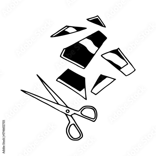 scissors cutting paper into pieces